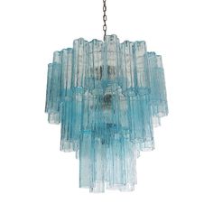 a blue glass chandelier hanging from a chain