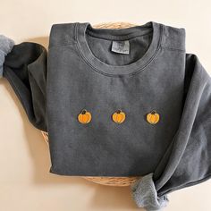 Cozy up with our Comfort Colors Pumpkin Crewneck Sweatshirt this fall season! This makes the perfect sweatshirt to lounge this fall and halloween season.  - Our sweatshirt material is super soft and high quality! ♡ - Garment-Dyed Sweatshirt (Sustainable style)  - 80% cotton, 20% polyester - All our sweatshirts run a UNISEX fit. (Both for men and women) They fit true to size. But if you like a more baggy look, we highly recommend sizing up. - These letters are embroidered iron-on patches that have been heat pressed, not embroidered. Rest assured, they'll be fully in tact after wash.  Please be mindful that we do not accept RETURNS / EXCHANGE / ORDER CANCELLATIONS in any way because this is made to order. We are also open for wholesale/bulk orders, kindly send us a message! Handmade in Chica Orange Crew Neck Sweatshirt For Loungewear, Cozy Orange Crew Neck Top, Gray Crew Neck Sweatshirt For Fall, Fall Cotton Soft-washed Sweatshirt, Soft-washed Cotton Sweatshirt For Fall, Cozy Crew Sweatshirt For Fall, Cozy Crew Neck Sweatshirt For Fall, Soft-washed Crew Neck Top For Fall, Halloween Crew Neck Sweatshirt For Loungewear