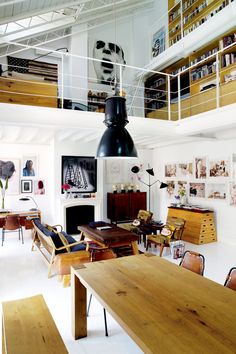 a living room filled with furniture and a fire place