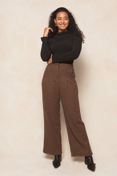 Get ready to strut your stuff in our Tabitha Trousers! Made from a chic houndstooth woven fabric in brown, black, and rust, these ankle length slacks are the perfect addition to any fall wardrobe. With convenient pockets, a secure hook and bar closure, and full lining, these non-stretch slacks offer both style and functionality. Time to step up your fashion game! Brown Tapered Leg Bottoms For Fall, Brown Office Pants For Fall, Brown Bottoms For Fall Workwear, Brown Bottoms For Business Casual In Fall, Plaid Pants For Business Casual In Fall, Houndstooth Trousers For Workwear, Fitted Houndstooth Pants For Fall, Houndstooth Pattern Trousers For Work, Houndstooth Work Trousers