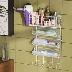 a bathroom wall shelf with three shelves holding toiletries