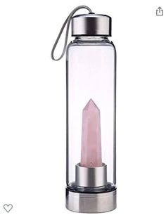 a pink candle in a glass container with a metal cap on the top and bottom