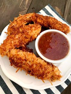 fried food on a plate with dipping sauce