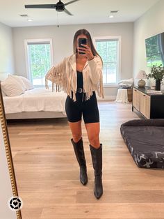 Fringe Jacket Concert Outfit, How To Style Fringe Jacket, Knee High Black Western Boots Outfit, Cowboy Boot Outfits Concert, Tan Fringe Jacket Outfit, Knee High Black Cowboy Boots, Tall Black Western Boots Outfit, Black Knee High Cowboy Boots Outfit, Concert Outfit With Cowboy Boots