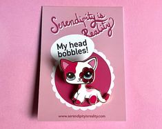 a pink card with a white and red cat on it's back, says sending its kitty buddy my head bobbles