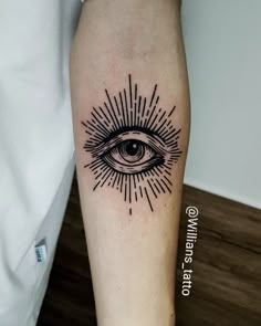 an all seeing eye tattoo on the leg