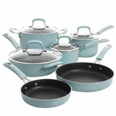 a set of pots and pans with lids