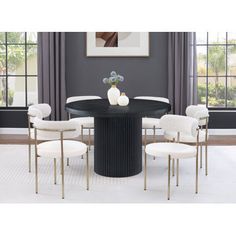 a black table with white chairs around it