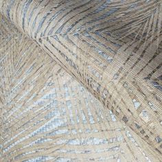 a close up view of an area rug with blue and beige designs on the fabric