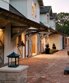 an outdoor patio area with chairs and lights