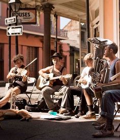 a group of men playing instruments on the street