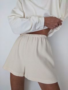 An all-season, easy pull-on short to pair with coordinating pieces from our In-House Collection as well as favorites from one's own closet. The Chloe Shorts in Rippled Cotton features an easy elastic waist with a relaxed, yet clean fit. The exquisite rippled fabric has an incredibly soft yet substantial hand, reminiscent of our favorite vintage pieces. We envision them paired with pieces from our In-House Sweats Collection. 100% Cotton Made in USA Due to the nature of this fabric, we encourage y Cleaning Outfits, Cream Shorts, Ribbed Knit Dress, Wide Leg Linen Pants, Shorts Outfit, Lazy Days, Minimal Style, Outfit Aesthetic, Vintage Pieces