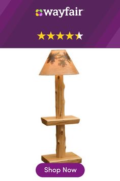 a lamp that is sitting on top of a wooden stand with five stars around it