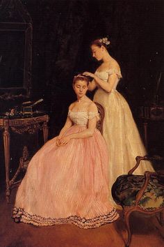 two women in dresses sitting next to each other