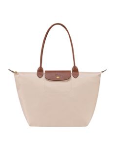 With a nod to timeless French style, Longchamp's spacious nylon tote perfects the carryall. Its packable design is primed for your daily commute or overseas adventures. Nylon Tote Bag, Wishlist 2024, Nylon Tote Bags, Nylon Tote, Longchamp Le Pliage, French Style, Christmas List, Fashion Inspiration, Bags Handbags