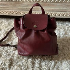 Perfect Condition Only Used Less Than Three Times Clean Inside And Out. Adjustable Straps. 8.5 X 9 X 5.5 Inch Come With Dust Bag Pet And Smoke Free Home. 100% Authentic. Longchamp Bag Le Pliage, Longchamp Red, Longchamp Bags, Leather Backpack, Adjustable Straps, Dust Bag, Backpacks, Pet, Red