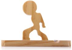 a wooden figurine that is standing on a stand with one foot in the air