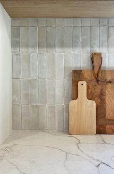 a cutting board sitting on top of a counter next to a cutting board and knife