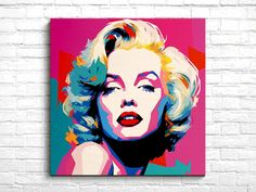 marilyn monroe pop art print on canvas in pink, blue and yellow colors with white brick wall