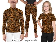 two children's clothes with tiger print on them