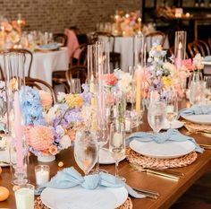 the table is set with plates and place settings