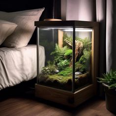 a bedroom with a bed and an aquarium in it