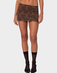 Elevate Your Mini Skirt Game With This Printed Mesh Option. This Mini Skirt Is The Perfect Way To Add A Pop Of Color To Balance Out Any Simple Basic. Mini Skirt. Center Bow Detail. Leopard Printed Design. Lined Mesh Fabric. Matching Set. 95% Polyester, 5% Spandex. Model Wears Size S. Model Height Is 5'8. Item Care: Wash With Similar Color. | Edikted Edin Leopard Print Mesh Mini Skirt Cute Skirts Fall, Going Outfits, Trendy Brown Skirted Bottoms, Cheetah Mini Skirt Outfit, Fitted Brown Skirted Bottoms, Cheetah Print Skirt, Stretch Brown Mini Length Bottoms, Brown Stretch Mini Length Bottoms, Leopard Print Mini Skirt