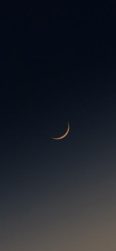 the moon is seen in the dark sky with no clouds on it's side