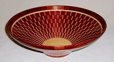 a brown and white bowl sitting on top of a table