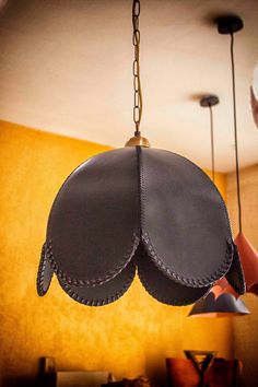 a pair of shoes hanging from a light fixture