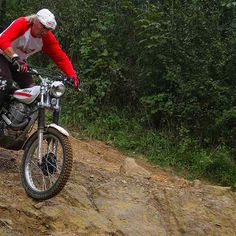 a man riding on the back of a dirt bike