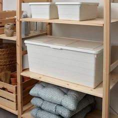 the shelves have bins and baskets on them, along with other items in boxes