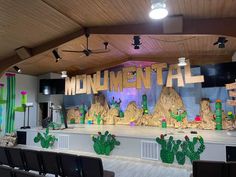 a stage set up with cactus decorations and the words'environmental'written on it