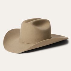 Part of our Buffalo collection, this cowboy hat is made in the USA of high-quality, weather-resistant 4X buffalo felt. Its classic Western profile features a classic cattleman crease, a 4" brim and a 4 1/2” regular oval crown. Additional details include a leather sweatband, satin lining, and a self-matching hat band wi Felt Cowboy Hat, American Buffalo, Modern Cowboy, Felt Cowboy Hats, Stetson Hat, Men’s Boots, Wear Store, Wide Trousers, Thigh Boot