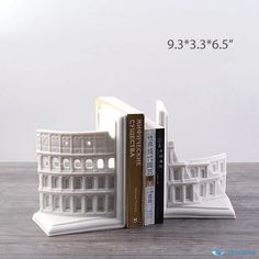 the bookend is made out of plastic and has two books on each side,