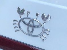 an emblem on the side of a white car