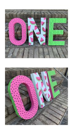 two large wooden letters that say one and one with watermelon slices on them