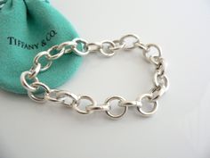 Overview:Offered for sale is a wonderful, super versatile, and gorgeous Tiffany & Co. Sterling Silver Circles Link Charm Clasp Bracelet. Each of the Larger Circle links have a hinge that "opens and closes", allowing you to very easily attach (and remove) charms from each of the links! Super cool piece that only Tiffany can come up with! It is definitely a Tiffany piece that you will get your money's value for. It works perfectly with pretty much any attire your put on, AND is a great stateme Clasp Bracelet, Gift Love, Bracelet Clasps, Enamel Charms, Weekend Wear, Outfit Women, Bracelet Bangle, Tiffany Heart, Heart Charm Bracelet