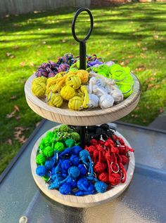 two tiered trays filled with different colored yarn