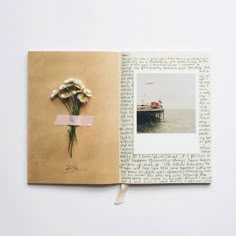 an open book with pictures and flowers on it