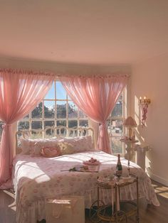 a bedroom with pink drapes and curtains