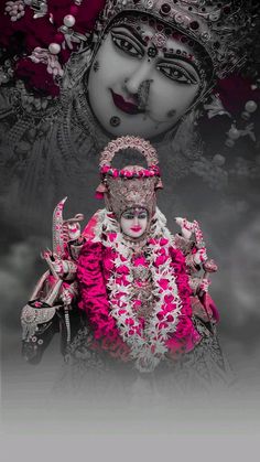 an idol is displayed in front of a black and white background with pink flowers on it