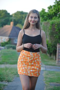 ♥Super cute and rare 80s/90s vintage orange floral daisy mini skirt with horse-bit detail at the waist! ♥The hem needs an iron as you can see in photos ♥Label states size 10 but it comes up much smaller and would best fit UK sizes 6-8 - please see measurements. ♥Waist measurement: 25 inches ♥Length measurement: 15 inches ♥Model is size 8 and 5'5 ♥Overall in good vintage condition, however the button holes are fraying and there are some signs of wear which is reflected in the price- please see cl Cheap Retro Mini Skirt For Women, Cheap Retro Mini Skirt With Stretch, Orange Fitted Retro Mini Skirt, Retro Fitted Mini Skirt With Floral Print, Retro Fitted Floral Mini Skirt, Orange Retro Mini Skirt, Fitted Retro Orange Mini Skirt, Fitted High Waist Orange Mini Skirt, Fitted High-waist Orange Mini Skirt