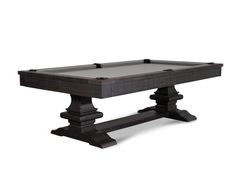 an old style pool table with black wood legs and grey cloth on the bottom edge