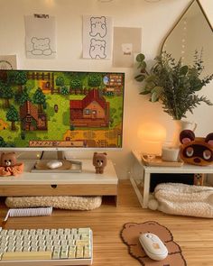 a desk with a computer, keyboard and mouse on it next to a teddy bear figurine