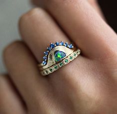 Unique engagement sunset ring set with an black opal, sapphires and emeralds, an original design by Minimalvs - Capucinne.
Perfect bohemian bridal set made of three stacking rings, a half moon ring, curved matching band and a full eternity band.
The prices listed are for three rings.
The design can be made with gemstones of your choosing. If you would prefer a custom ring, please contact us before purchase.
Details Upper curved band Gemstone: blue sapphires Size: approx. 2.5mm (1), 1.75mm (8)
Su Sunset Ring, Black Opal Ring, Moon Black, Bohemian Bridal, Unique Engagement Ring, Three Rings, Moon Ring, Custom Ring, Put A Ring On It