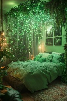 a bed with green comforter and pillows in a room filled with plants, lights and pictures on the wall