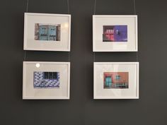 three framed photographs hanging on the wall