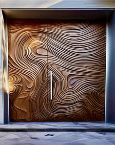 a wooden door with an abstract design on it