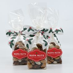 two bags filled with nuts sitting next to each other